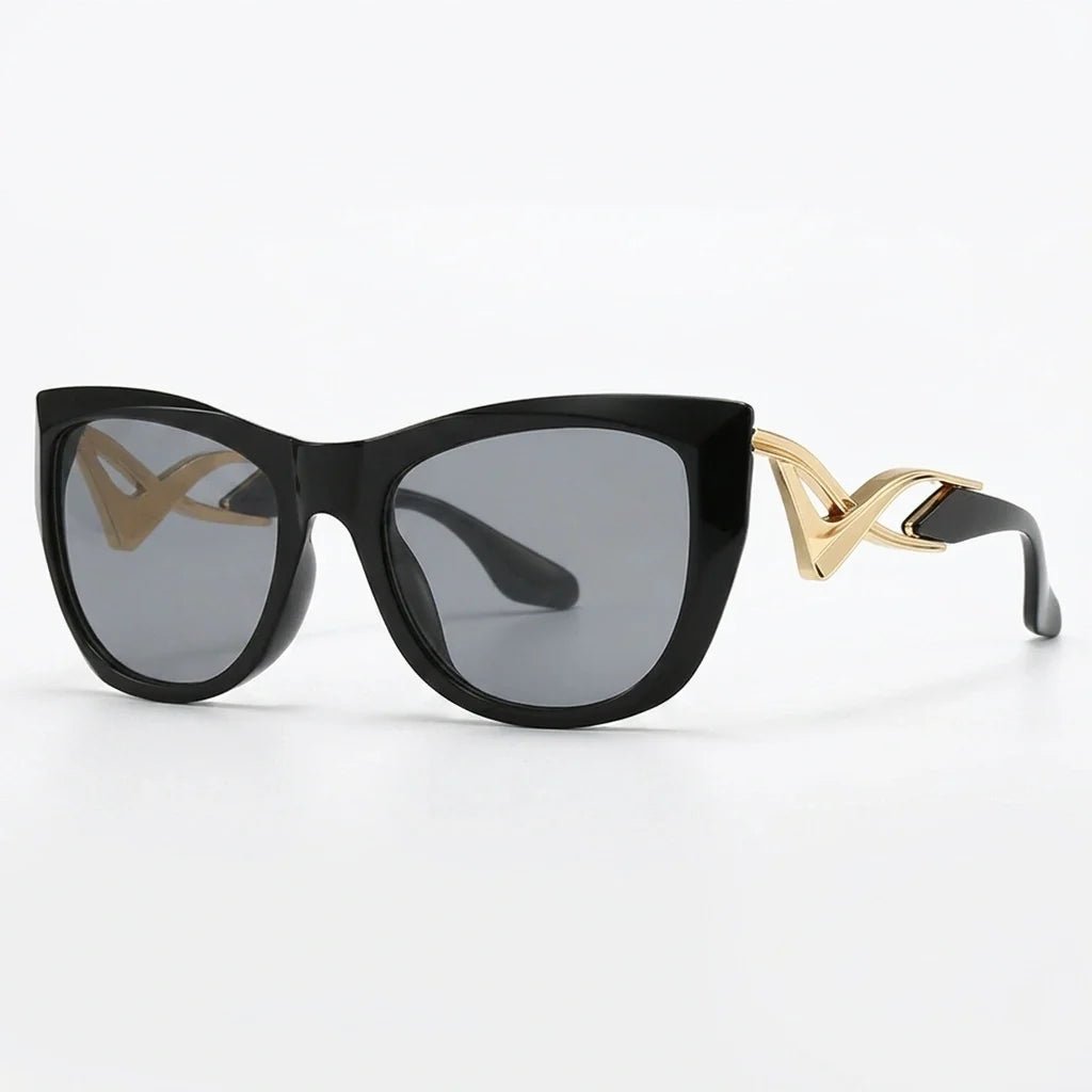 Liora Lunettes de soleil œil de chat oversize UV400 à verres dégradés et détails en métal doré - Hommfer