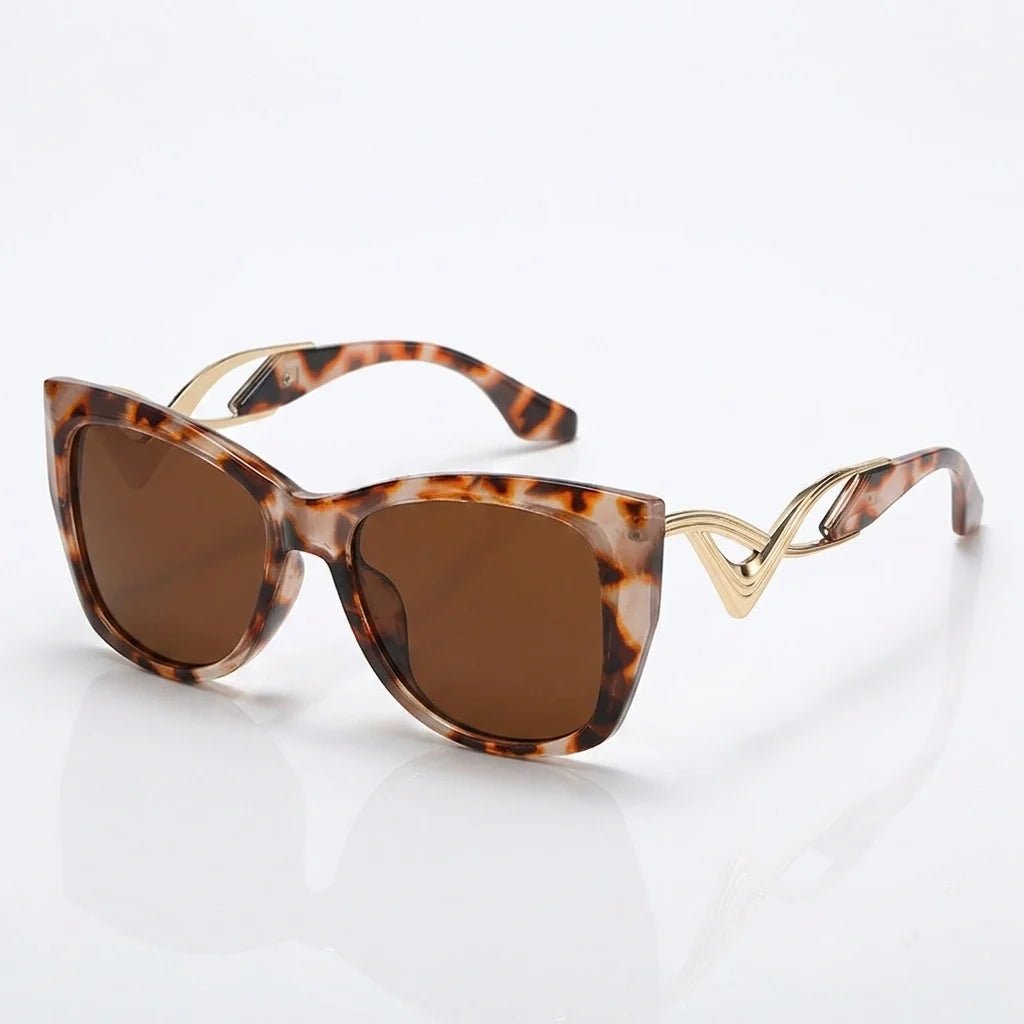Liora Lunettes de soleil œil de chat oversize UV400 à verres dégradés et détails en métal doré - Hommfer